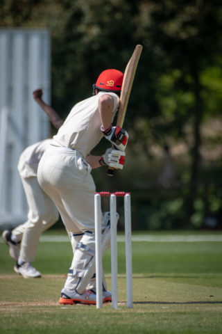 Magdalen College School Sixth Form pupil playing cricket